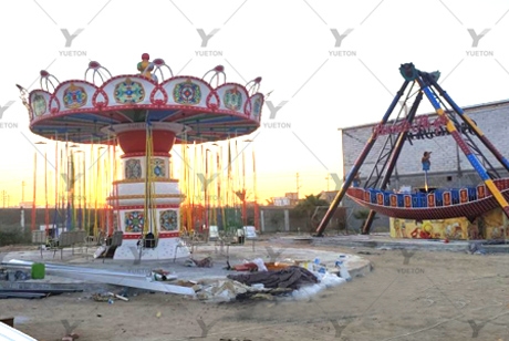 Yueton amusement park rides light up the Iraqi sky